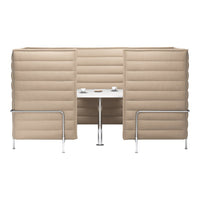 Beige upholstered booth with vertical channeling and a white tabletop, featuring chrome legs for a modern look.