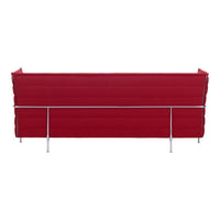 Red tufted sofa with sleek chrome legs, featuring a modern, minimalistic design. Perfect for any contemporary space.
