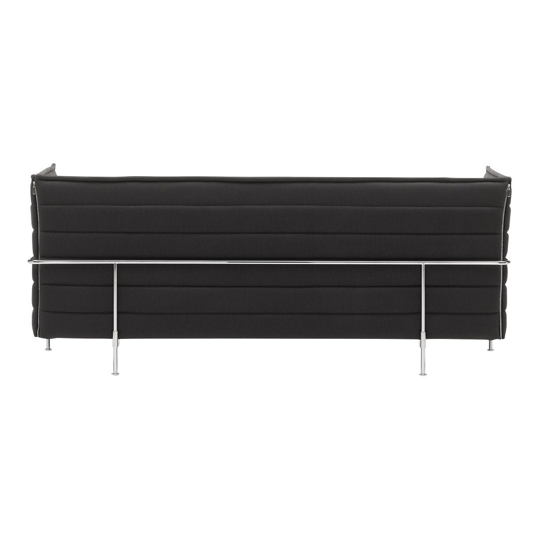 Black upholstered sofa with horizontal stitching, featuring a sleek chrome frame for a modern look.