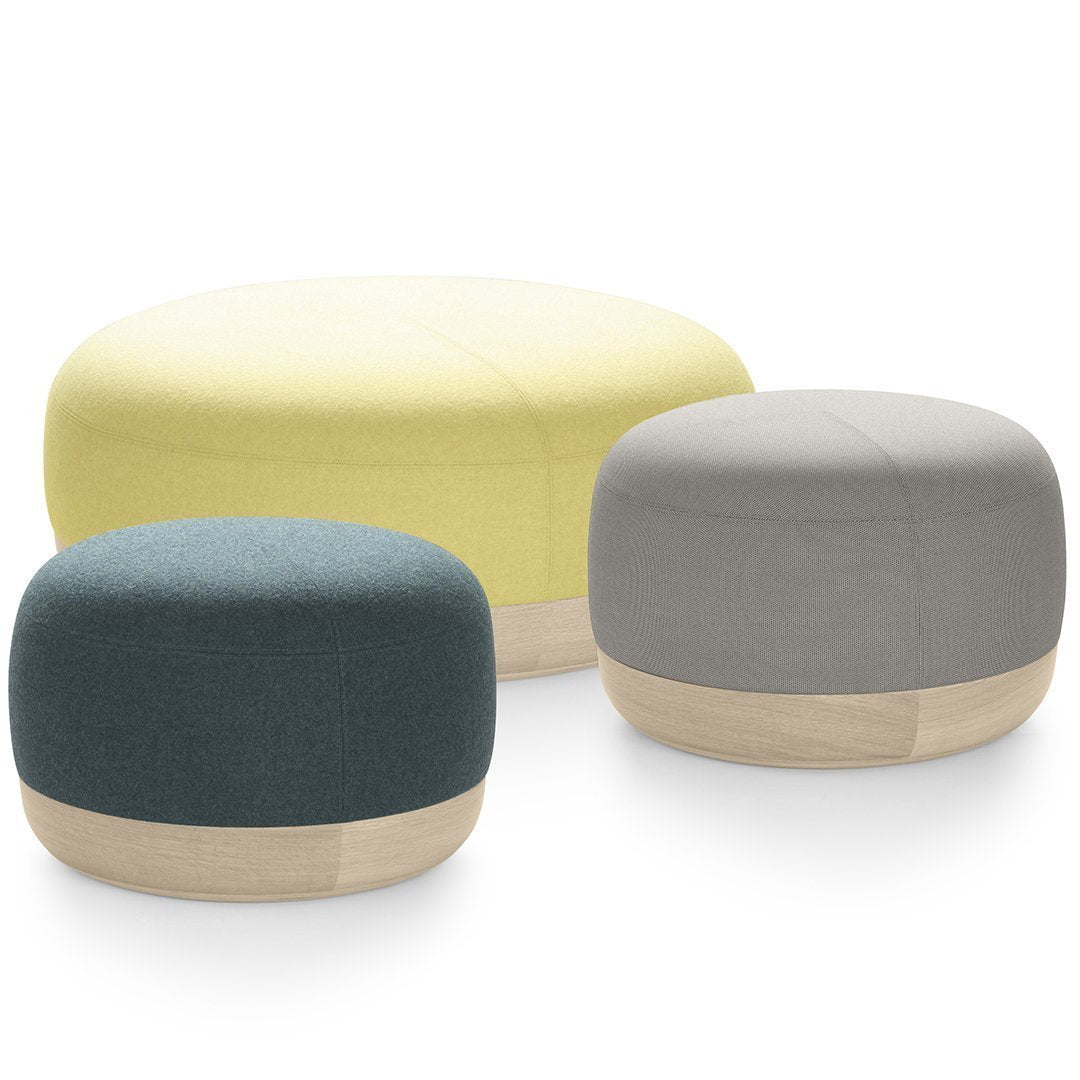 Colorful poufs in yellow, teal, and gray with natural wooden accents and smooth, modern design. Perfect for any decor.
