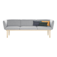 Gray sofa with modern design, light wood legs, and decorative pillows in dark green, navy, and mustard yellow.