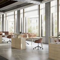 Modern office space featuring light wood tones, soft beige upholstery, and neutral gray accents. Bright, airy atmosphere.