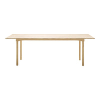 Light wood dining table with a smooth, plain surface and simple, natural finish, ideal for modern interiors.
