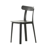 Modern black dining chair with a sleek matte finish and minimalistic design. Perfect for contemporary spaces.