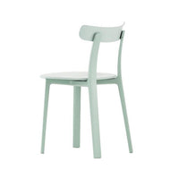 Mint green chair with a sleek design and a smooth, clean finish. Perfect for modern decor styles.