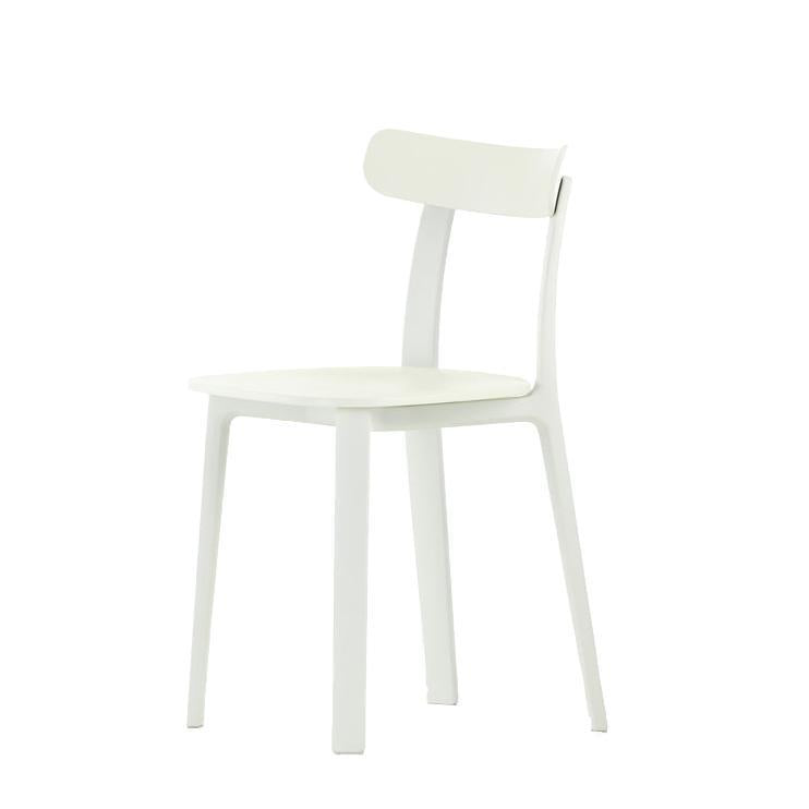 White minimalist chair with a smooth finish and simple, clean lines. Ideal for modern decor.