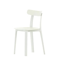 White minimalist chair with a smooth finish and simple, clean lines. Ideal for modern decor.
