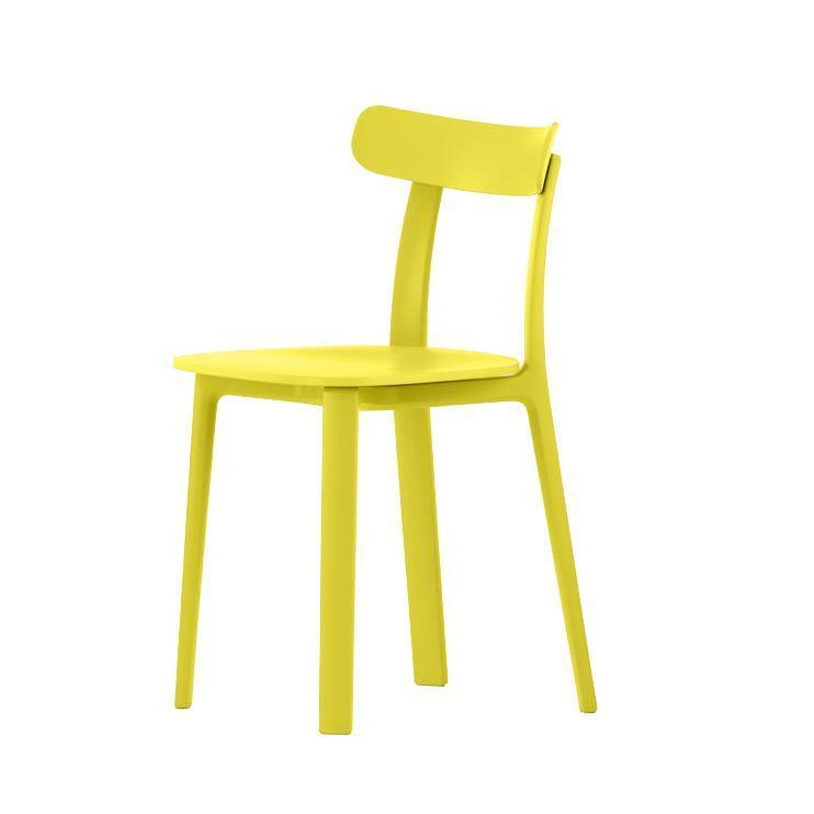 Bright yellow chair with a minimalist design and smooth finish, perfect for modern decor.