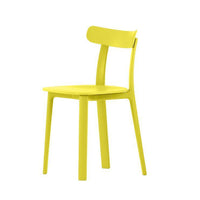 Bright yellow chair with a minimalist design and smooth finish, perfect for modern decor.