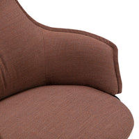 Brown textured fabric with subtle patterns on a cozy chair armrest and seat cushion.