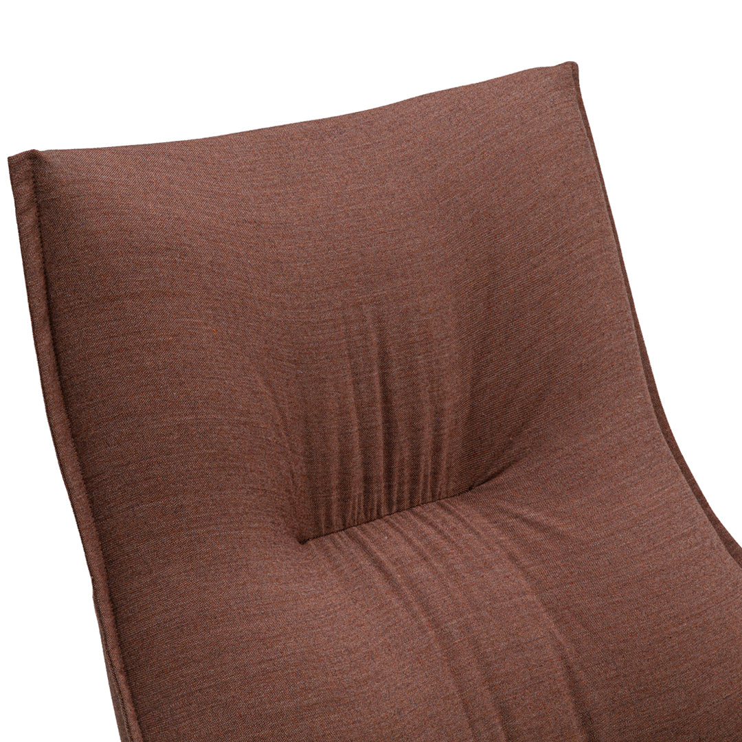 Textured brown cushion with subtle patterns, featuring soft folds and a plush finish perfect for comfort and style.