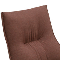 Textured brown cushion with subtle patterns, featuring soft folds and a plush finish perfect for comfort and style.