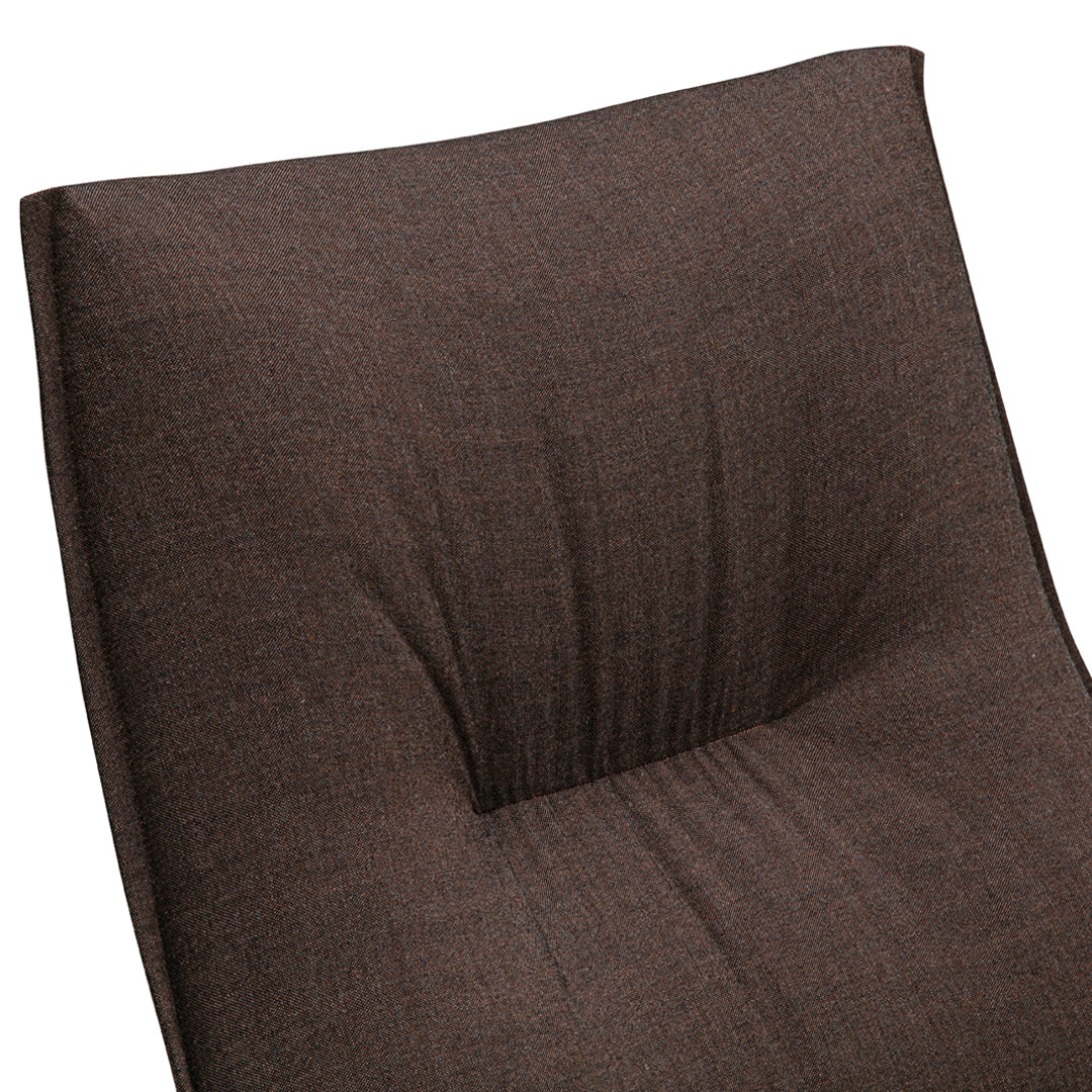 Brown textured fabric with a subtle, tufted pattern, ideal for modern seating solutions.
