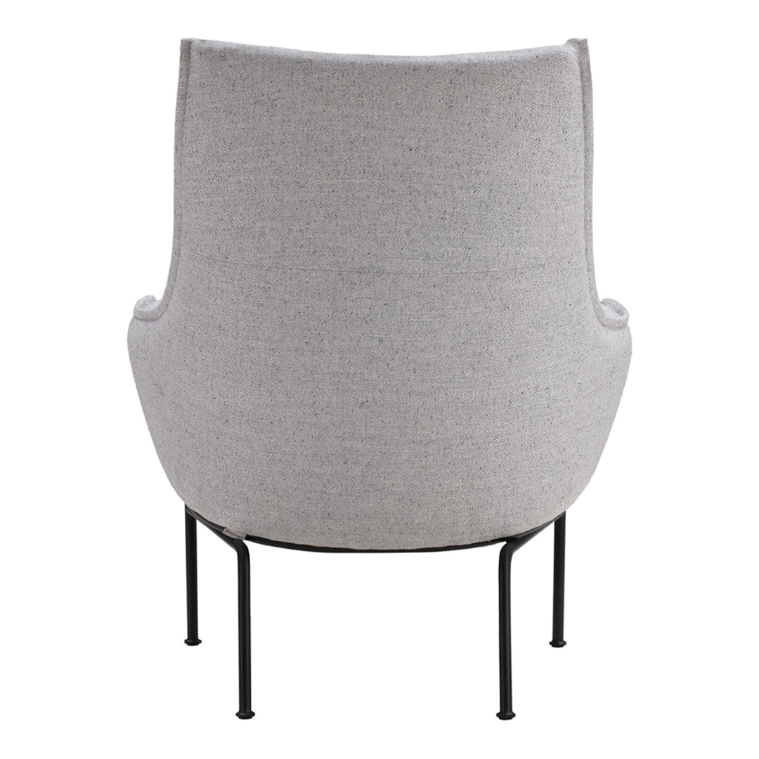 Textured light gray armchair with minimalist black metal legs, perfect for modern decor.