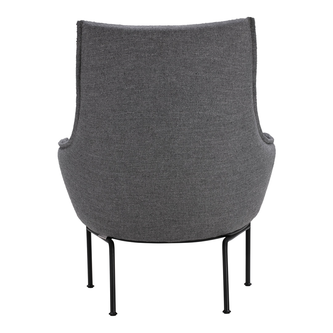 Gray upholstered chair with a smooth, textured finish and minimalist black metal legs.