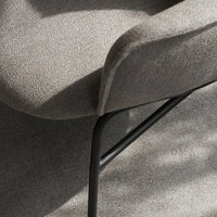 Gray fabric chair with a subtle textured pattern and black metal legs, showcasing a modern aesthetic.