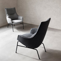 Modern lounge chairs in sleek gray upholstery with minimalist black metal legs, perfect for contemporary decor.