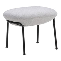 Gray upholstered ottoman with a smooth oval shape and sleek black metal legs. Modern and minimalistic design.