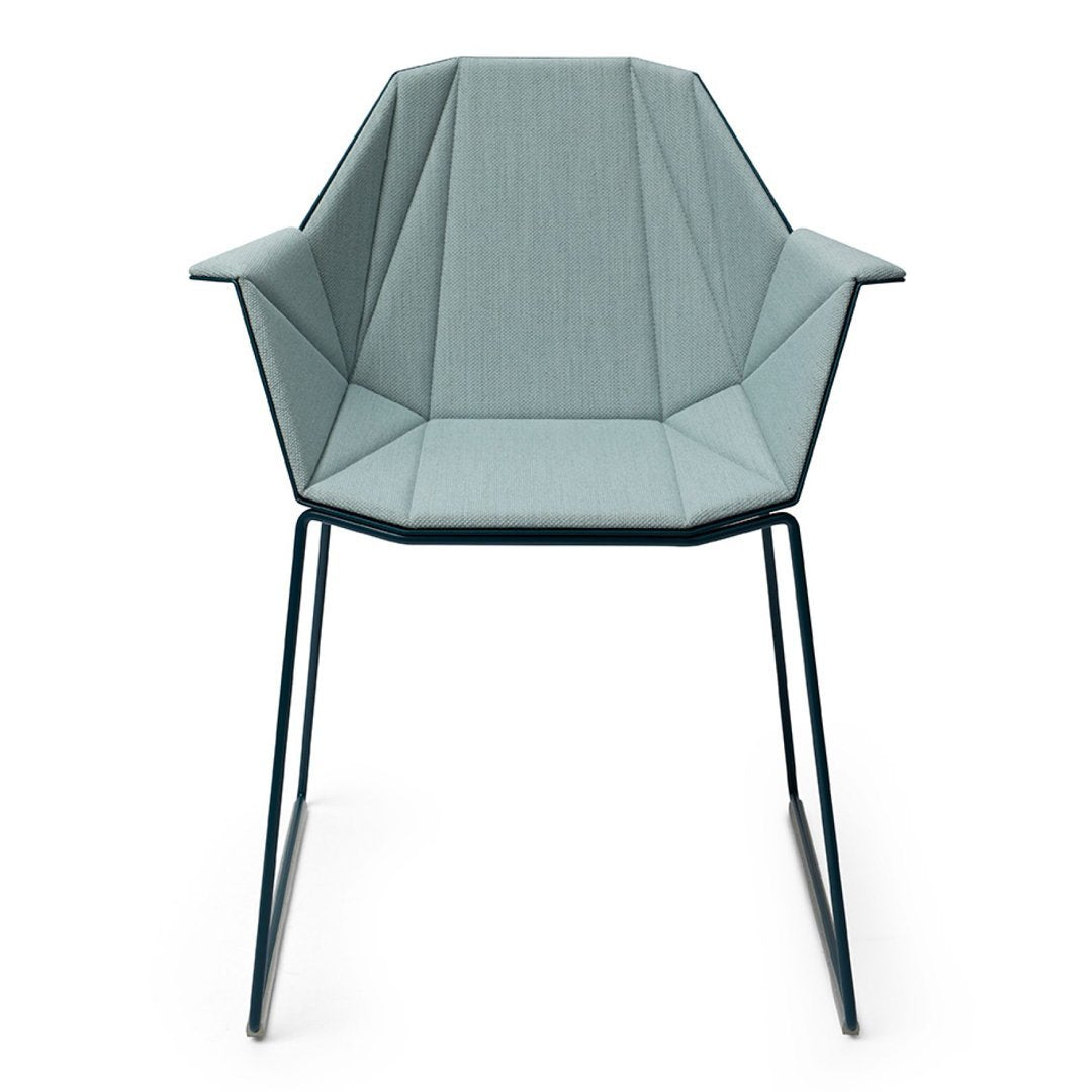 Light blue geometric-patterned chair with sleek metal legs, perfect for modern decor.