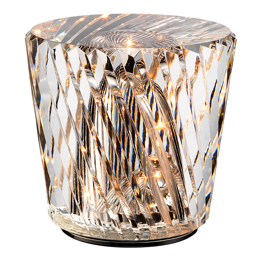 Crystal accent table with a faceted, textured design reflecting light in hues of clear and warm gold.