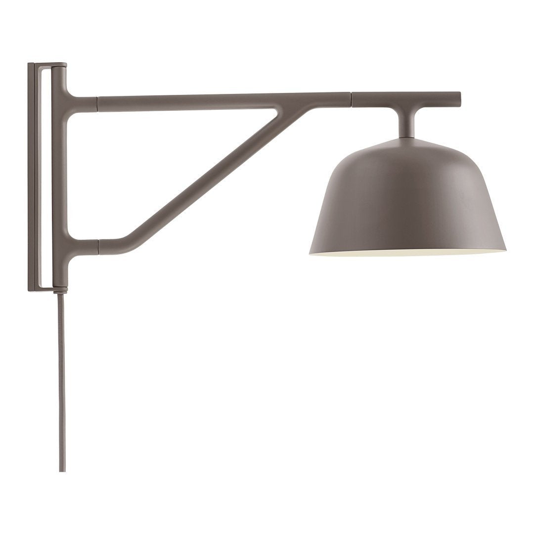 Stylish wall lamp in muted brown with a sleek design and smooth, rounded shade. Ideal for modern decor.