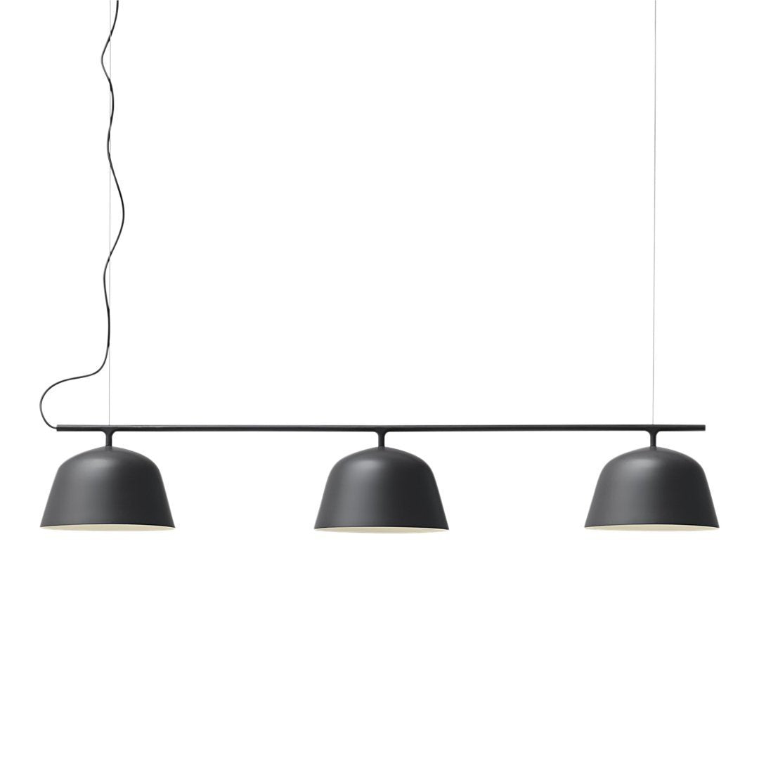 Stylish three-bulb pendant light in matte black, featuring smooth curves and minimalist design. Perfect for modern decor.