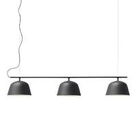 Stylish three-bulb pendant light in matte black, featuring smooth curves and minimalist design. Perfect for modern decor.