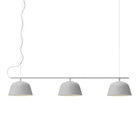 Modern three-light pendant lamp in sleek white finish with smooth, rounded shades and minimalist design.