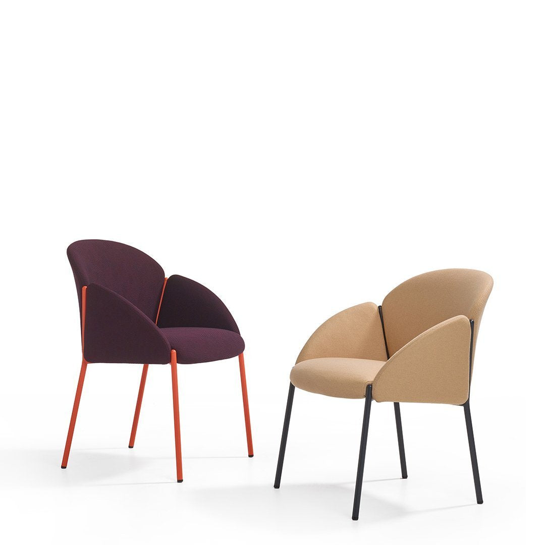 "Two stylish chairs featuring a deep purple and warm beige upholstery with vibrant red and black legs."