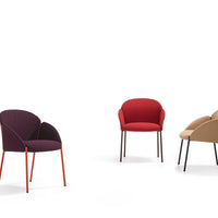 Three chairs in burgundy, red, and beige with sleek, colorful metal legs against a white background.
