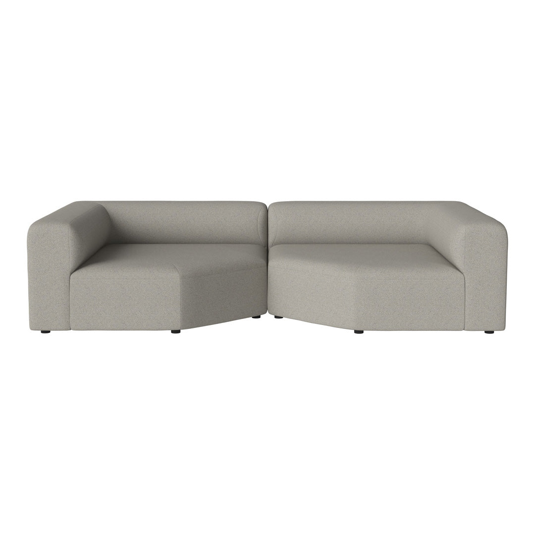 Modern gray sectional sofa with a minimalist design and soft, textured fabric. Perfect for contemporary living spaces.