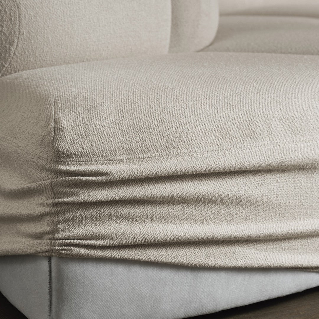 Soft beige textured fabric with subtle sheen and smooth gray accents. Ideal for modern home decor.
