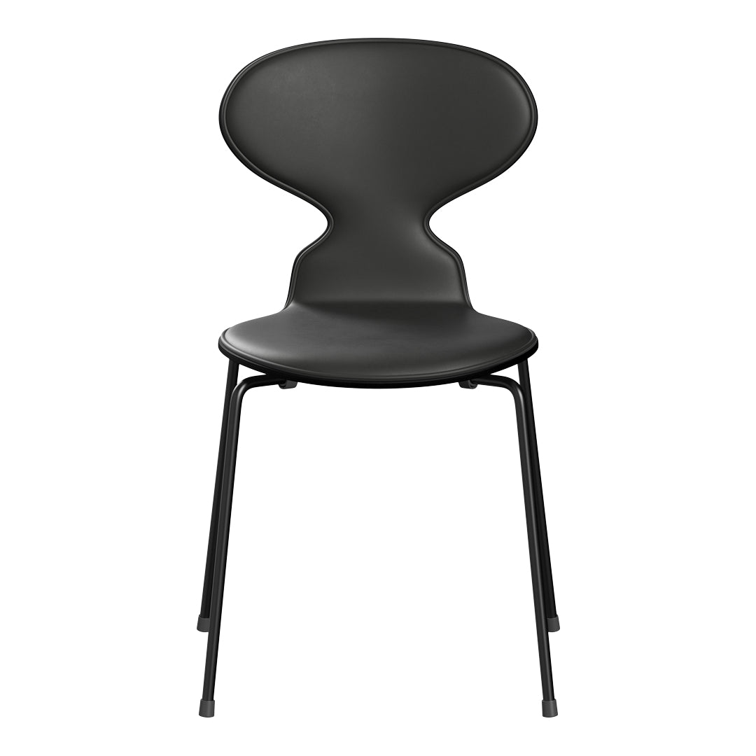 Sleek black chair with a minimalist design, featuring smooth curves and simple metal legs. Perfect for modern interiors.
