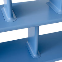 Blue shelving unit with a sleek, minimalist design and smooth, solid blue surfaces.