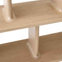 Light oak wood shelving unit with smooth, natural grain pattern and simple, minimalist design.