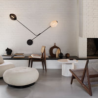 Modern black and white lamp with geometric patterns in a chic, neutral-toned living space.
