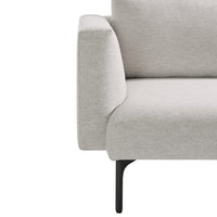 Light gray upholstery with a smooth texture and minimalist design, complemented by sleek black legs.