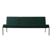 Green upholstered sofa with a sleek black metal frame, featuring a textured minimalist design. Perfect for modern decor.