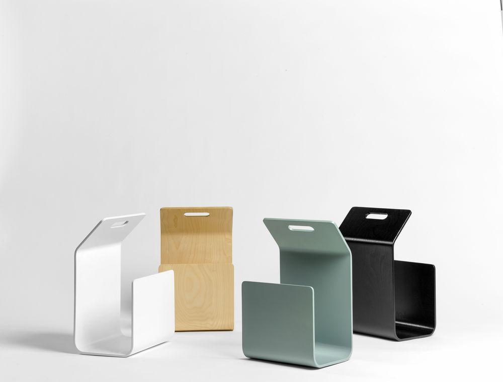 Four modern storage boxes in white, light green, black, and natural wood, featuring sleek, minimalist designs.