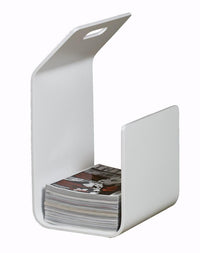 Sleek white magazine holder with a minimalist design, featuring smooth surfaces and clean lines. Perfect for modern decor.