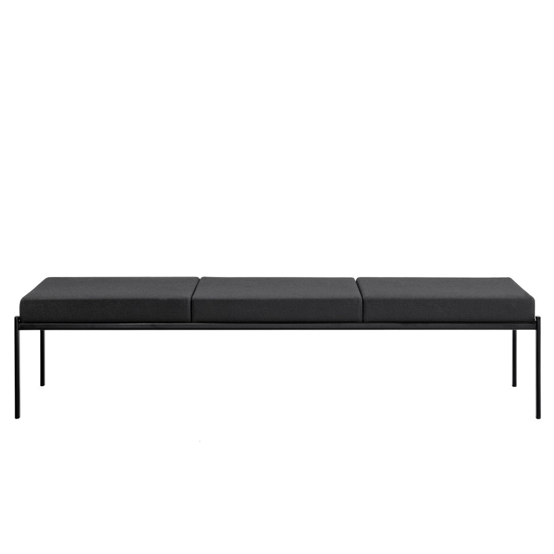 Black minimalist bench with a smooth, sleek design and three cushion sections on a sturdy metal frame.