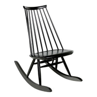 Black wooden rocking chair with sleek lines and a minimalist design. Perfect for modern interiors.