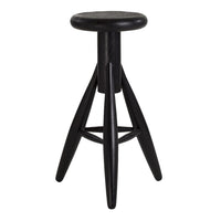 Black wooden stool with a round seat and angular legs, featuring a sleek, minimalist design.