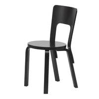 Stylish black wooden chair with a sleek, minimalist design and smooth surfaces, perfect for modern interiors.