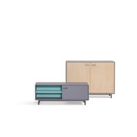 Modern furniture set featuring light wood and sleek gray accents with teal drawers. Simple, contemporary design.