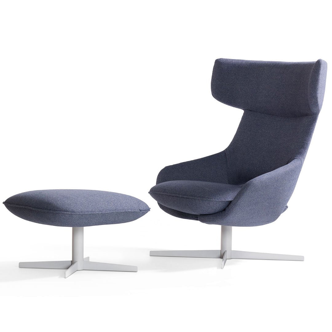 Contemporary blue upholstered chair and ottoman set with a sleek metal base for modern interiors.
