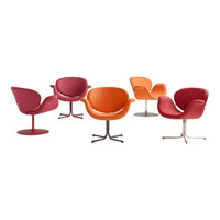 Colorful modern chairs in shades of pink, orange, and red with smooth, curved designs and sleek metal bases.