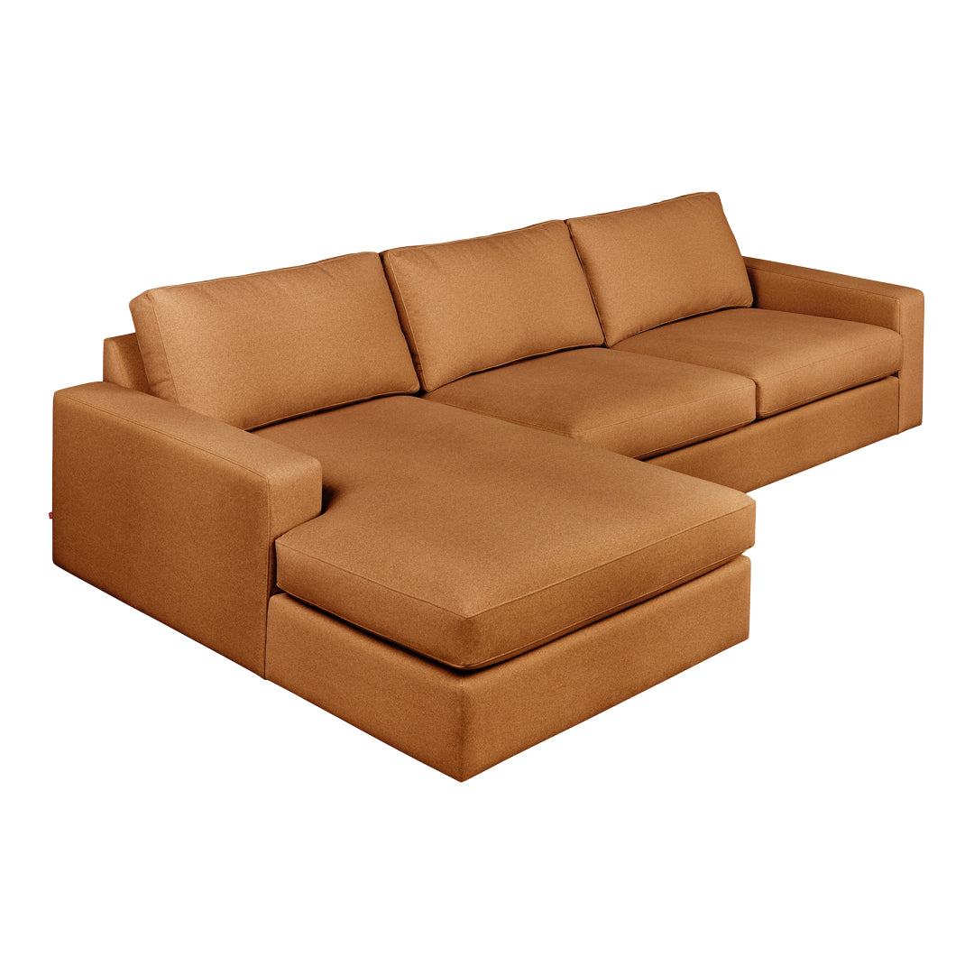 "Contemporary brown sectional sofa with a smooth, solid fabric and elegant lines, perfect for modern living spaces."