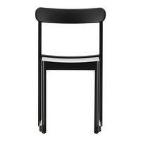 Black chair with a minimalist design and smooth matte finish, featuring a contrasting white seat.
