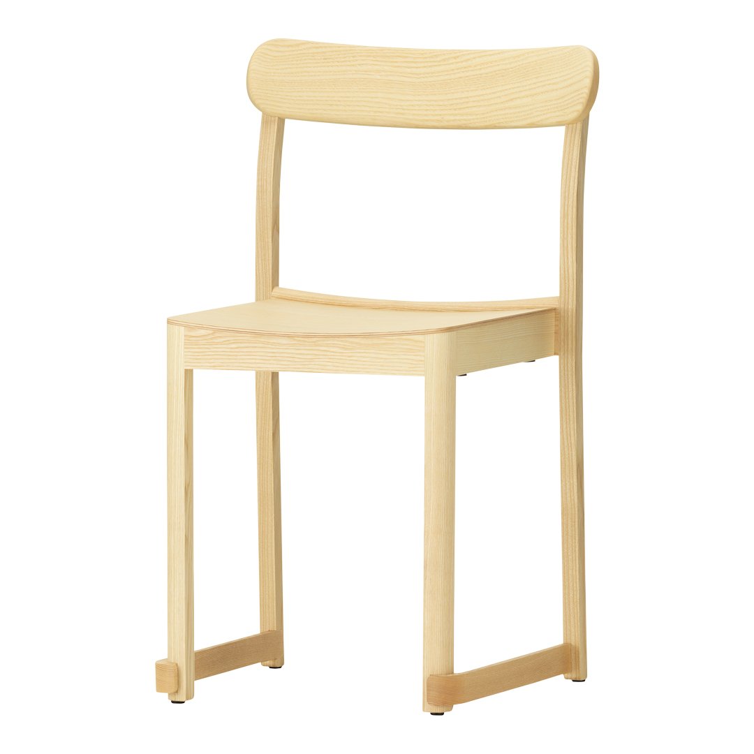 Light wooden chair with a natural finish and simple, smooth lines; no patterns. Ideal for minimalist decor.